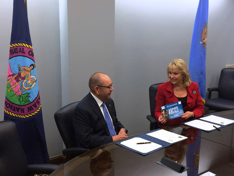 Governor Anoatubby, State of Oklahoma sign license plate compact