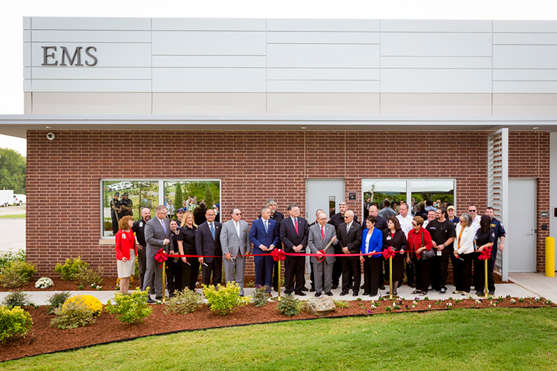 Governor Bill Anoatubby, center, is joined by U.S. Rep. Tom Cole, tribal leaders, legislators and dignitaries to officially open the Emergency Medical Services building on the south Ada campus, Thursday, Sept. 21. The new structure helps expand the services provided by the tribe to Chickasaw citizens and other Native Americans.